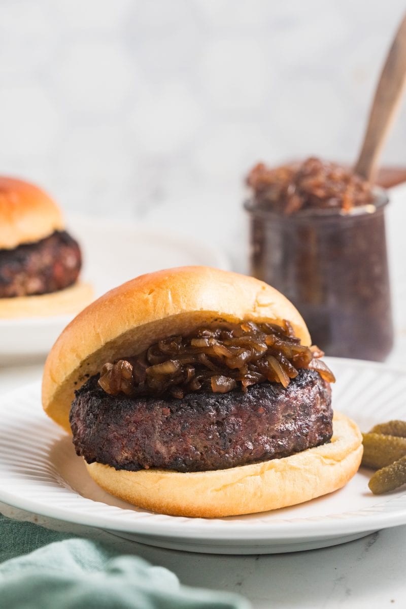A blue cheese burger topped with onion jam. 