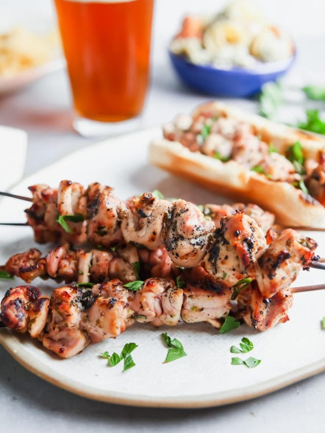 A platter of grilled chicken skewers