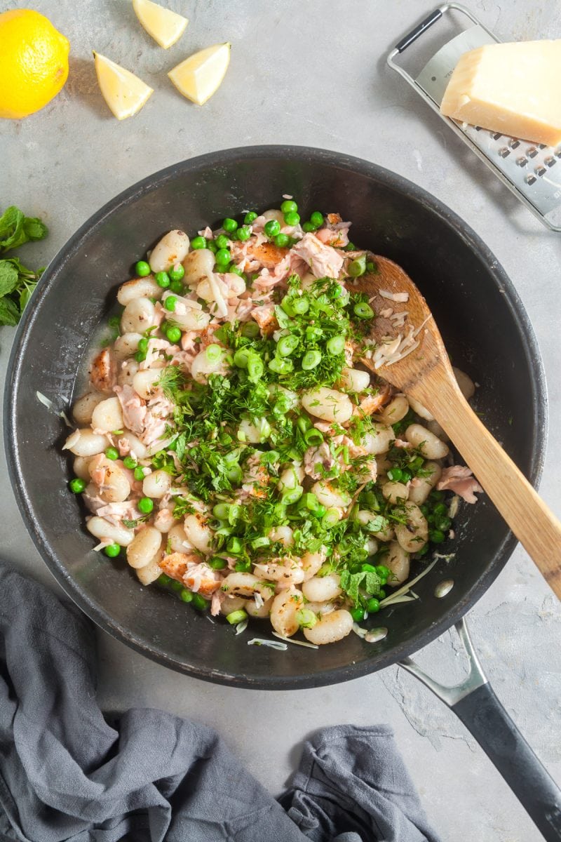 Adding the peas and herbs. 