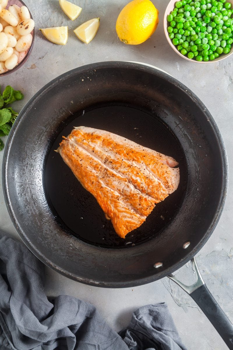 Searing the salmon. 